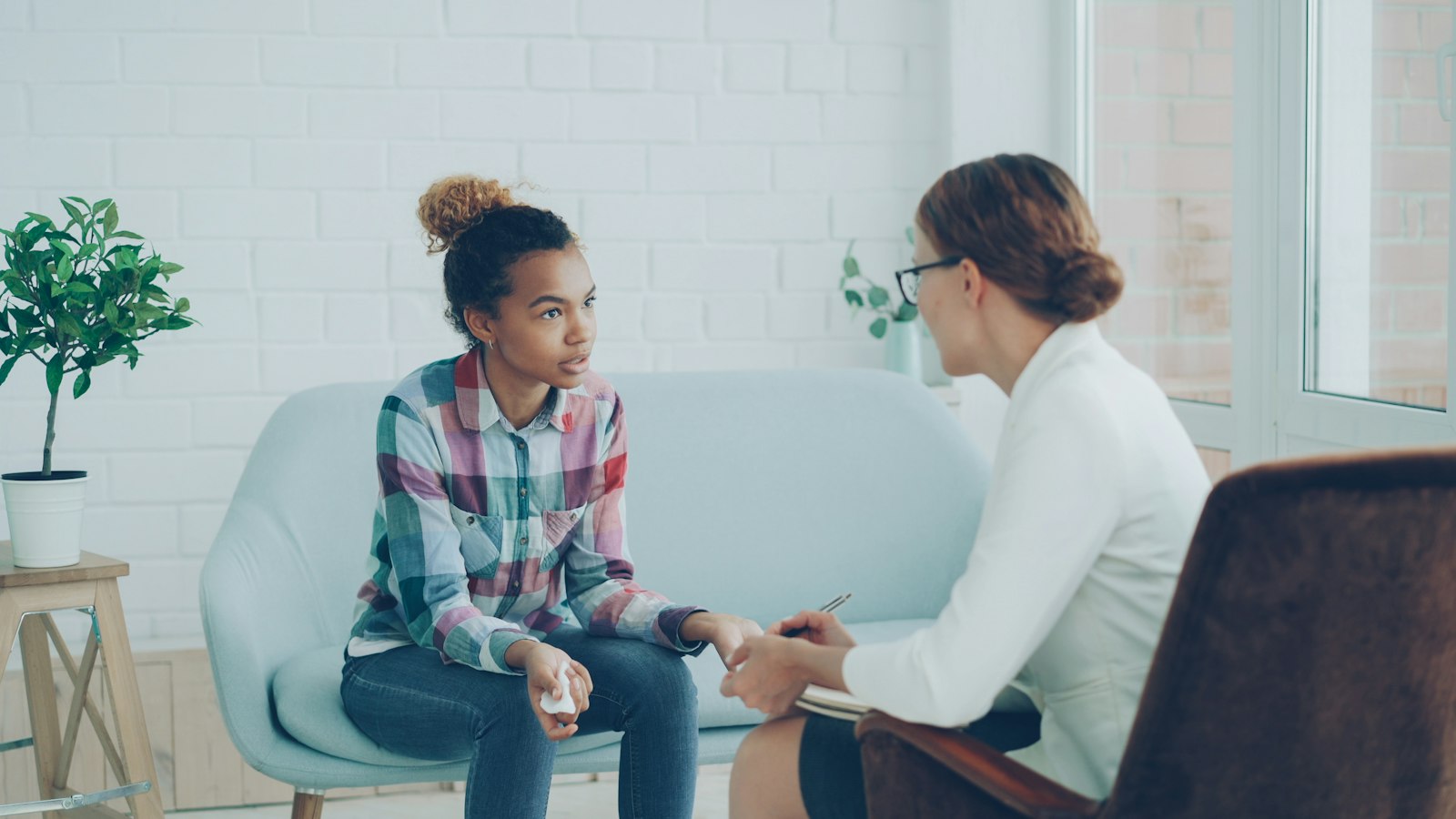 Practitioner listening to a client during a first appointment